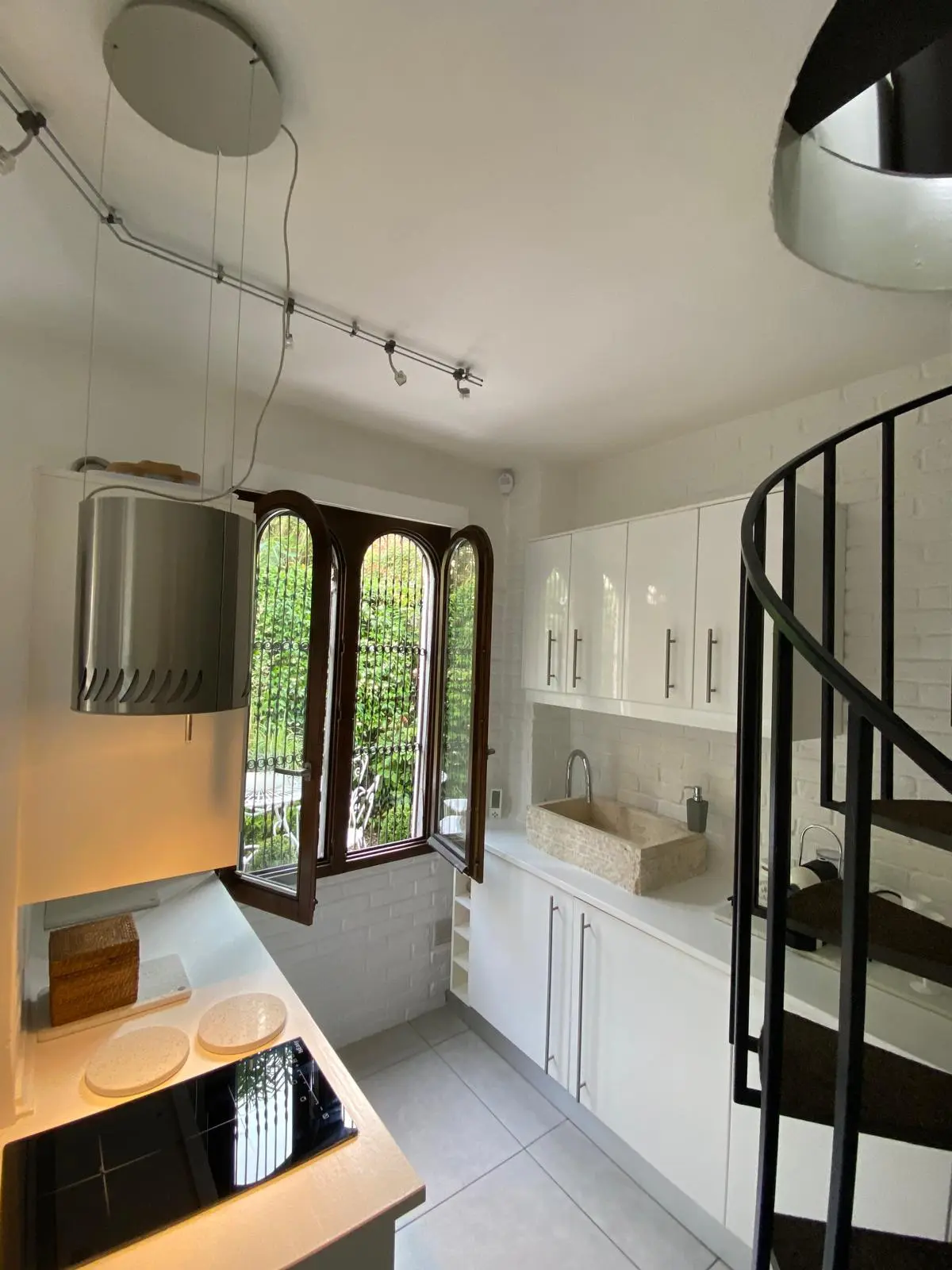 Kitchen and dining area with spiral staircase