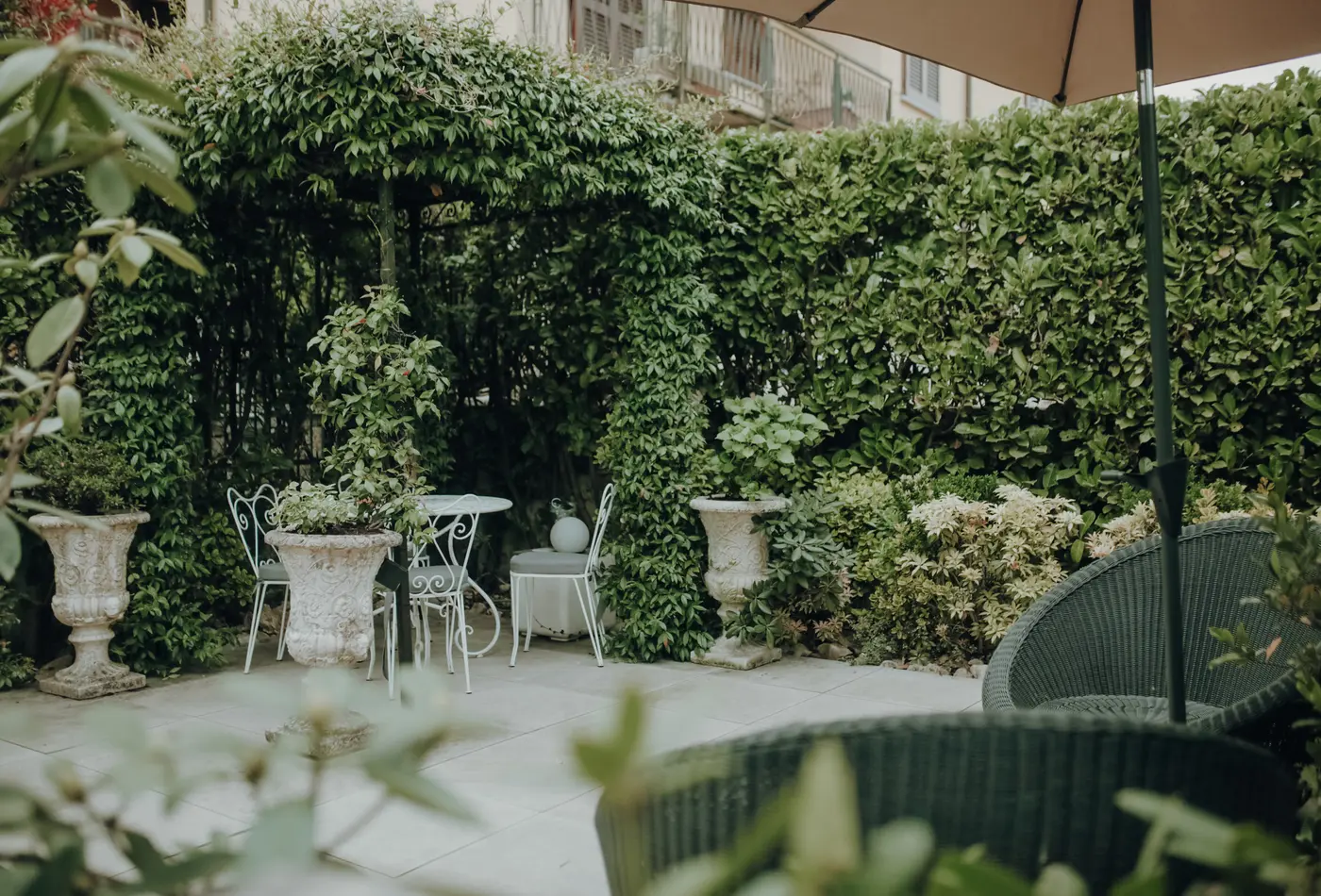 Private garden seating surrounded by greenery