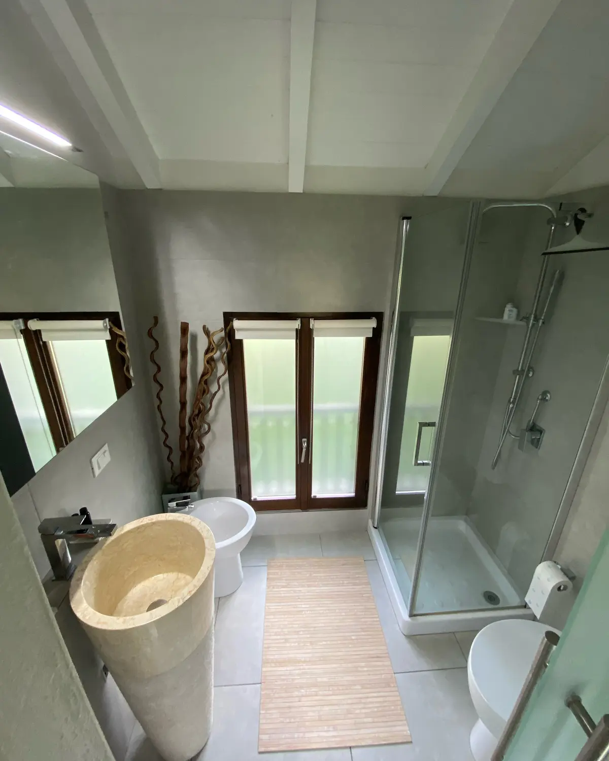 Bright bathroom with freestanding basin