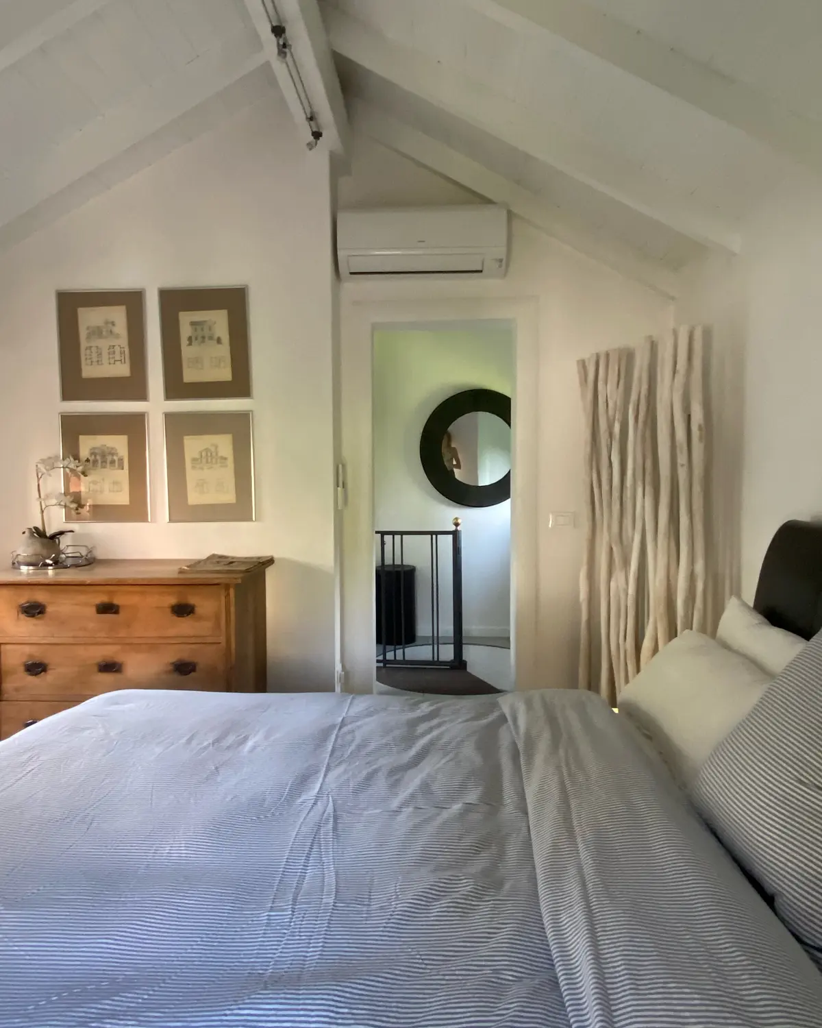 Bedroom with double bed and calm neutral tones