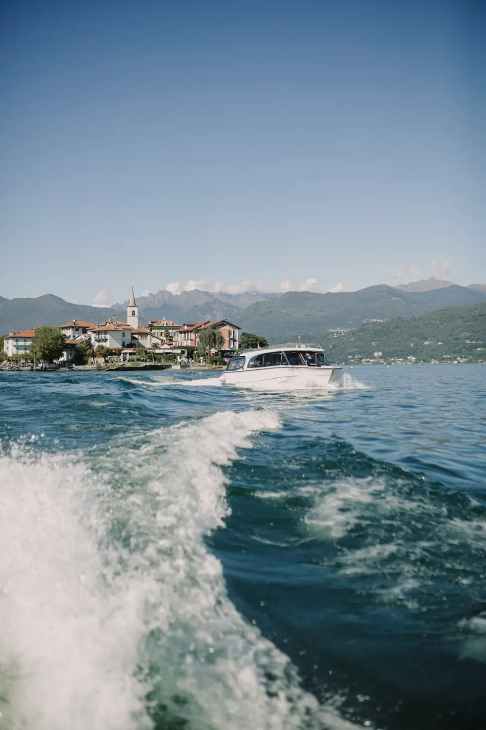 Motorboat crossing Lake Maggiore near Stresa